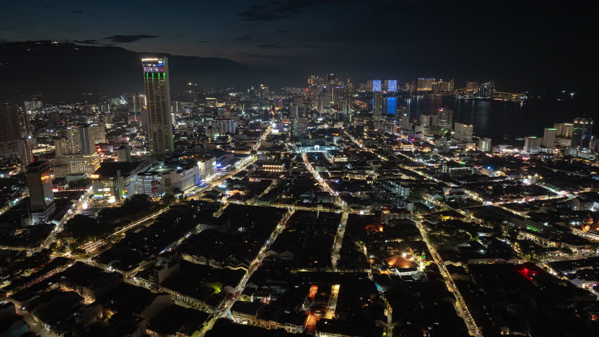 night time illuminated penang island george town cityscape aerial panorama 4k timelapse malaysia