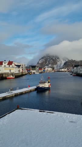 Scenic view of the waterfront harbor in a fishing village in winter, Henningsvaer, Austvagoya,Lofoten Islands. Norway
