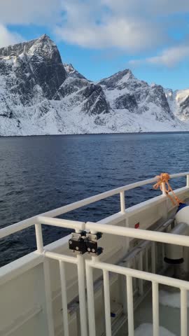 Fishing boat in the fjord.  of Lofoten Islands, Norway. Industrial fishing. View from a drone.  Mountains and sea. Image of Norway
