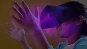 Child wearing VR headset initiating purple mist while tracing shapes and exploring technology. Children, innovation, futuristic, immersive, playful, creativity, digital - Powered by Shutterstock - Get 15% off with code: PIKWIZARD15
