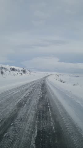 Road covered in ice and snow in Finland
