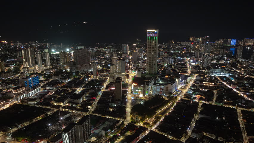 night time illuminated penang island george town city center famous tower aerial panorama 4k timelapse malaysia
