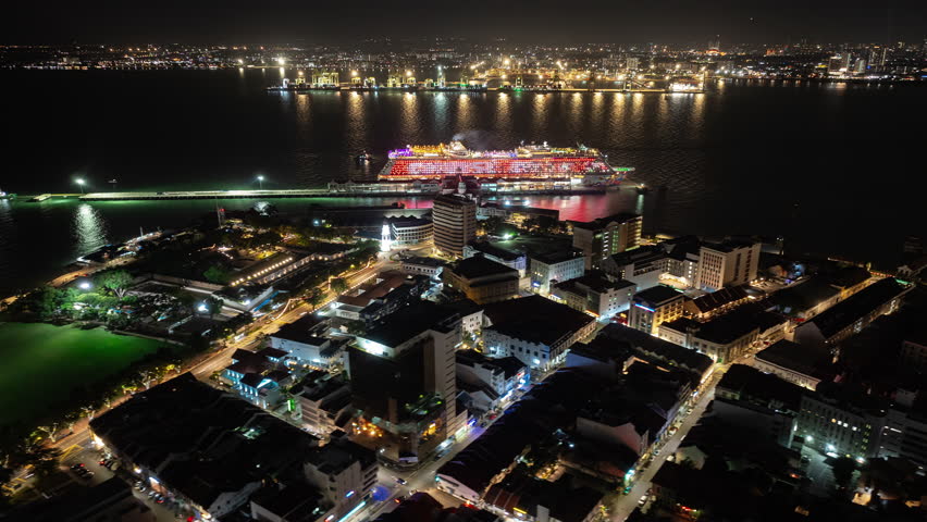 night illumination penang island george town central pier cruise liner parking dock aerial panorama 4k timelapse malaysia
