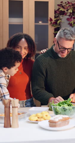 Grandparents, family and children with turkey at thanksgiving dinner, happy and bonding on holiday. Senior people, girl and boy with smile for food, celebration and excited with talk in dining room