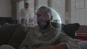 Mid adult man on couch observing globe hologram flowing technology data, senior peer pouring coffee. Technology, innovation, collaboration, futuristic, workspace, digital, professional - Powered by Shutterstock - Get 15% off with code: PIKWIZARD15