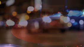 Defocused night street revealing emergency lights pulsing red blue signaling urgent response. Urban, nightlife, motion, abstract, chaos, safety, neon - Powered by Shutterstock - Get 15% off with code: PIKWIZARD15