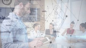 Bearded man tapping tablet visualizing network data overlay around colleagues at business meeting. Technology, teamwork, collaboration, digital, innovation, corporate, modern - Powered by Shutterstock - Get 15% off with code: PIKWIZARD15