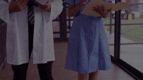 Line graphic sweeping left initiating medical graphs fluctuating as doctor and nurse reviewing data. Healthcare, analytics, collaboration, technology, diagnostics, professional, innovation - Powered by Shutterstock - Get 15% off with code: PIKWIZARD15