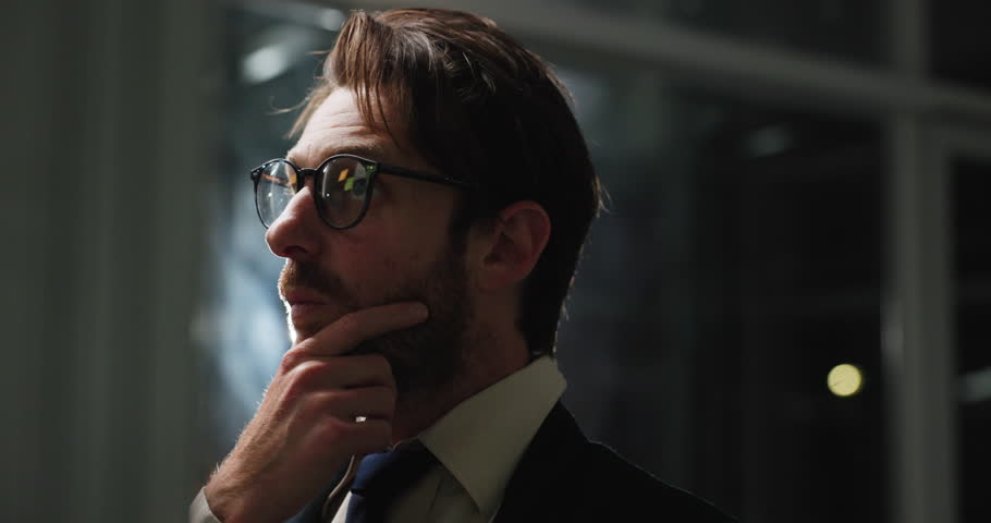 Night, thinking and business man with board for insurance policy, schedule or planning. Office, brainstorming strategy and broker problem solving for coverage, reading or vision for project deadline