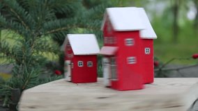 Charming close-up of Christmas village miniature houses with festive decor, including miniature trees and lights, perfect for holiday decorations, gifts, and festive cheer and joy - Powered by Shutterstock - Get 15% off with code: PIKWIZARD15
