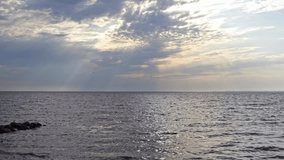 Sun Rays Stream Through Dramatic Clouds Over A Vast Choppy Sea Creating A Moody Atmospheric And Peaceful Horizon - Powered by Shutterstock - Get 15% off with code: PIKWIZARD15