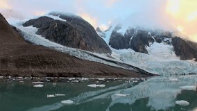 See the mesmerizing view of the Arctic glacier slowly melting into the sea. Behold the mountains shrouded in clouds. Gaze upon the ice floes as they drift on the chilly waters of Svalbard. - Powered by Shutterstock - Get 15% off with code: PIKWIZARD15
