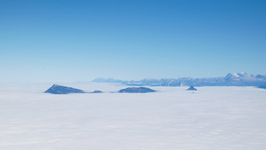 The breathtaking view of a cloud blanket covering the entire central Swiss plateau. Shoot on a full-frame camera from the top of Pilatus Mountain next to Lucerne.