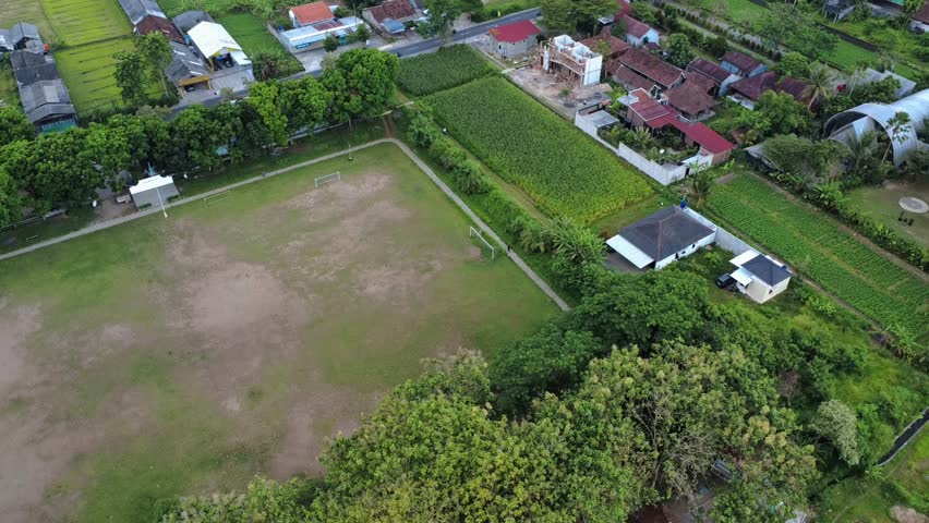 Sports field in a village in Yogyakarta, Indonesia: Amazing Aerial View in 4K Video