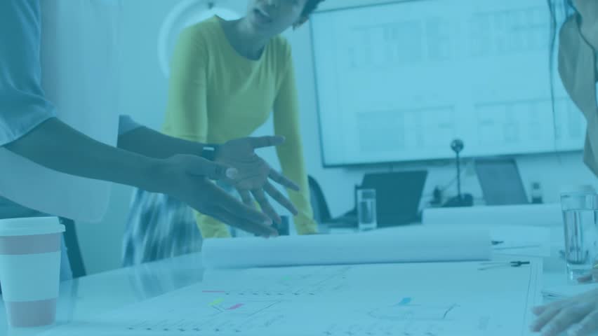 Animating data overlay for business presentation with two colleagues pointing at printed plans. Collaboration, teamwork, data visualization, professional, corporate, digital interface, modern office - Powered by Shutterstock - Get 15% off with code: PIKWIZARD15