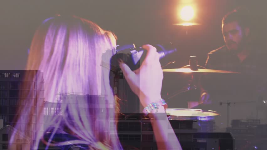 Photographer raising DSLR tracking shooting band performing for music production with urban overlay. Concert, performance, artist, stage, entertainment, energy, creative