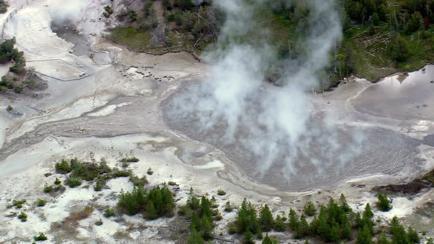 Steaming geothermal hot spring in Yellowstone National Park aerial view scenic