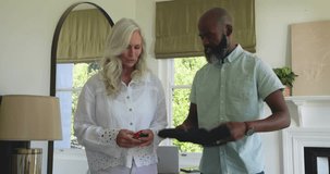 Senior woman handing AR glasses to man during tech demo initiating floating molecular models. Technology, innovation, collaboration, futuristic, education, gadget, teamwork - Powered by Shutterstock - Get 15% off with code: PIKWIZARD15