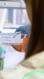 Animation of chemical formula and data processing over caucasian female scientist doing experiment. Global science and digital interface concept digitally generated video. - Powered by Shutterstock - Get 15% off with code: PIKWIZARD15