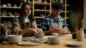 Caucasian woman man couple date handmade master class in pottery workshop potter sculptor artist modeling clay together crafts hobby enjoying handcraft in art studio happy girl guy smiling high five - Powered by Shutterstock - Get 15% off with code: PIKWIZARD15