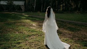  bride in a white dress goes into the forest - Powered by Shutterstock - Get 15% off with code: PIKWIZARD15
