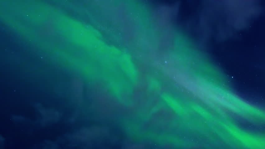 Mesmerizing real northern lights shimmering and swirling with vibrant green colors across the dark blue night sky filled with stars, a breathtaking celestial spectacle from Sweden