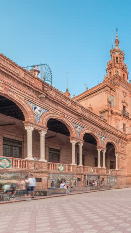 Plaza de Espana in Seville timelapse hyperlapse, a grand architectural complex in Maria Luisa Park built for the Ibero-American Exposition. Bridges and vintage streetlights during sunset