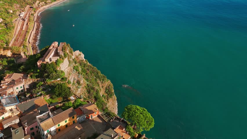 Aerial view of the Corniglia town in the famous Cinque Terre, Italian Riviera, Liguria, Italy. Stunning historic village with colorful buildings nestled between cliffs and the Ligurian Sea. 