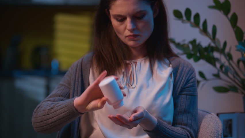 Caucasian sad woman unwell sick at home night depressed female girl health problem stress drugs addict drink medication pills insomnia overdose tablets medicine painkiller antidepressant suffer alone