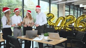 Business people are celebrating holiday in modern office drinking champagne and having fun in coworking. Merry Christmas and Happy New Year 2026. - Powered by Shutterstock - Get 15% off with code: PIKWIZARD15