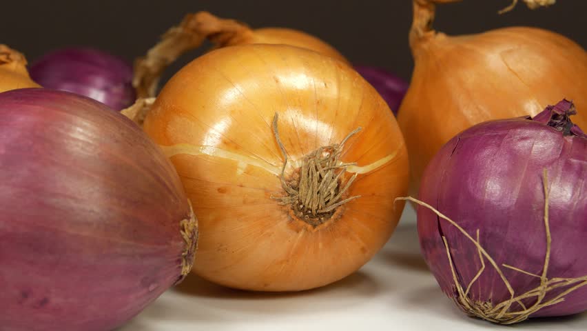 Bulb onion and red onion, which is also called purple onion. Onion - very healthy product with many beneficial properties for health, close-up shot video