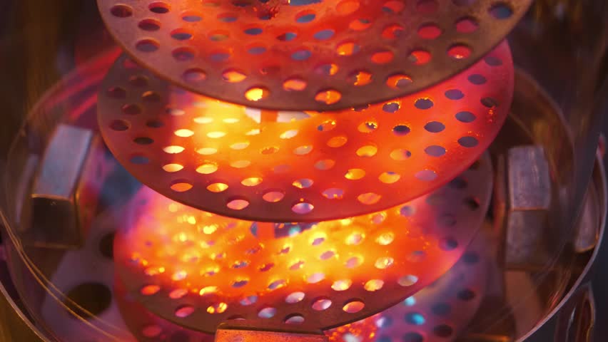 Heating device with red-hot metal spiral. Gas heater for outdoor use. The fire is burning in the calefactor