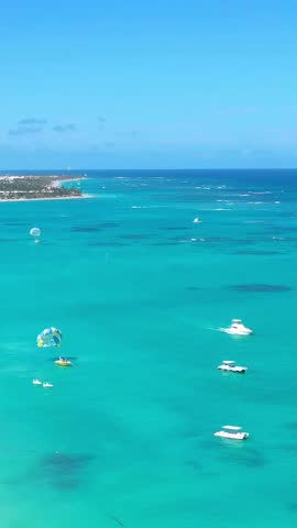 Tropical coastline with resorts, palm trees and caribbean sea. Travel destinations. Dominican Republic. Aerial view