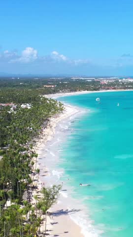 Tropical coastline with resorts, palm trees and caribbean sea. Travel destinations. Dominican Republic. Aerial view