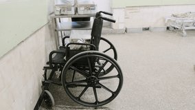 Hospital wheelchair standing in corridor showing concept of healthcare system medical equipment rehabilitation support elderly patient disability mobility aid recovery process emergency assistance - Powered by Shutterstock - Get 15% off with code: PIKWIZARD15