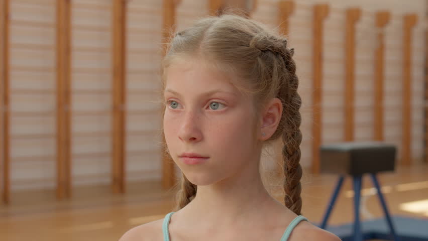 Caucasian girl portrait happy teen child kid smiling cheerful daughter schoolgirl sport training education in school gym workout joyful smile student pupil gymnast healthy young sportswoman indoors