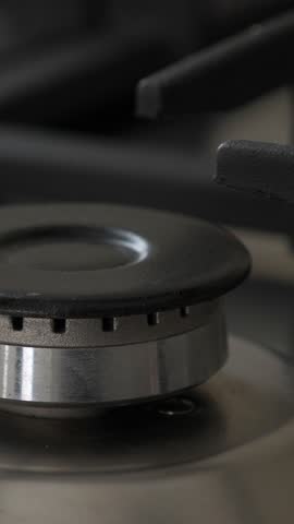 Gas oven with flame at the kitchen