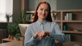 Caucasian businesswoman pointing on wristwatch time meeting in office smiling girl business woman employer CEO manager entrepreneur leader punctual wait meet check timing hand clock deadline timing - Powered by Shutterstock - Get 15% off with code: PIKWIZARD15