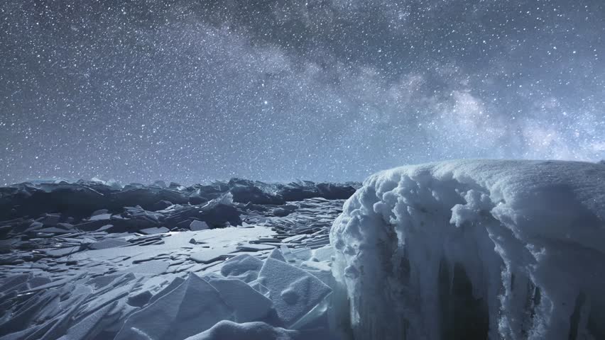 Beautiful winter night landscape, frozen lake under starry sky.