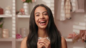 Beautiful woman portrait Hispanic Latina positive smiling girl teenage healthy natural beauty in bathroom home female happy teen gen z laughing toothy dental teeth care skincare shampoo hair cosmetics - Powered by Shutterstock - Get 15% off with code: PIKWIZARD15