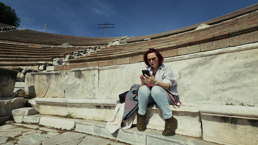 Archaeology Student Talking to Cellphone in the Ancient Rome Hospital Asclepieion of Pergamon View