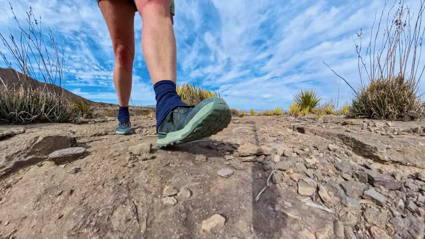 Feet Passing Cairns in Desert of Big Bend