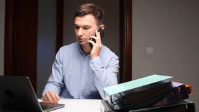 Businessman making phone call managing office work - Powered by Shutterstock - Get 15% off with code: PIKWIZARD15