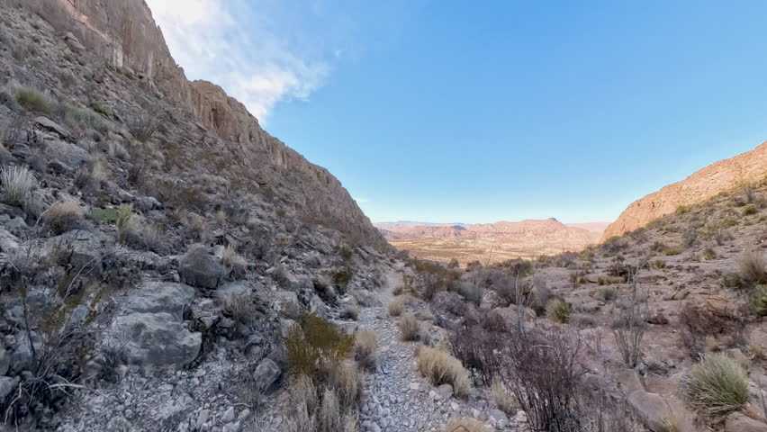 Hiking Over Rocky Trail Through Canyon in Big Bend National Park