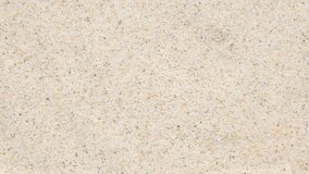 Center-focused water ripple forms concentric rings on sandy beach. Droplet impact creates dynamic motion and reflections, captured in natural light. Peaceful and meditative moment - Powered by Shutterstock - Get 15% off with code: PIKWIZARD15