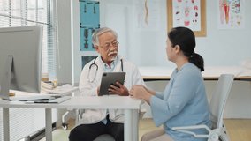 Elderly male doctor consulting a senior female patient while using a digital tablet for medical data review, demonstrating the integration of new technology and AI in modern healthcare services. - Powered by Shutterstock - Get 15% off with code: PIKWIZARD15