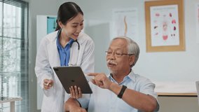 Asian female doctor using a digital tablet to explain health information to an elderly male patient, incorporating AI-assisted tools for better diagnosis, data analysis, and patient understanding. - Powered by Shutterstock - Get 15% off with code: PIKWIZARD15