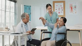 Asian senior woman in a wheelchair receives care from a male doctor and a female nurse during a checkup. Using a digital tablet, the team collaborates to assess and support her health needs. - Powered by Shutterstock - Get 15% off with code: PIKWIZARD15