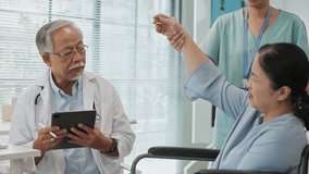 Asian senior woman in a wheelchair receives care from a male doctor and a female nurse during a checkup. Using a digital tablet, the team collaborates to assess and support her health needs. - Powered by Shutterstock - Get 15% off with code: PIKWIZARD15