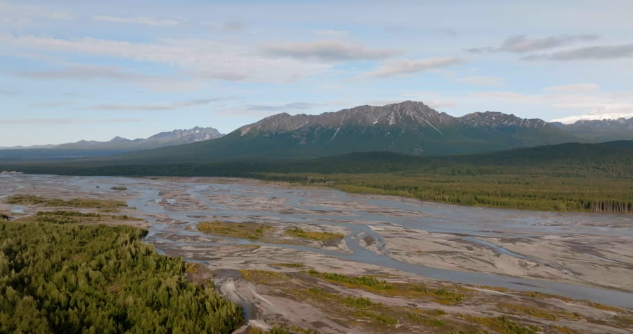 Flying backward above Susitna River towards Mount McKinley, the tallest mountain in North America, Alaska